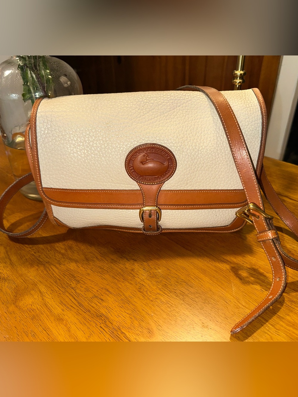 Vintage Dooney & Bourke Cream Pebbled Leather crossbody bag with Brown Trim